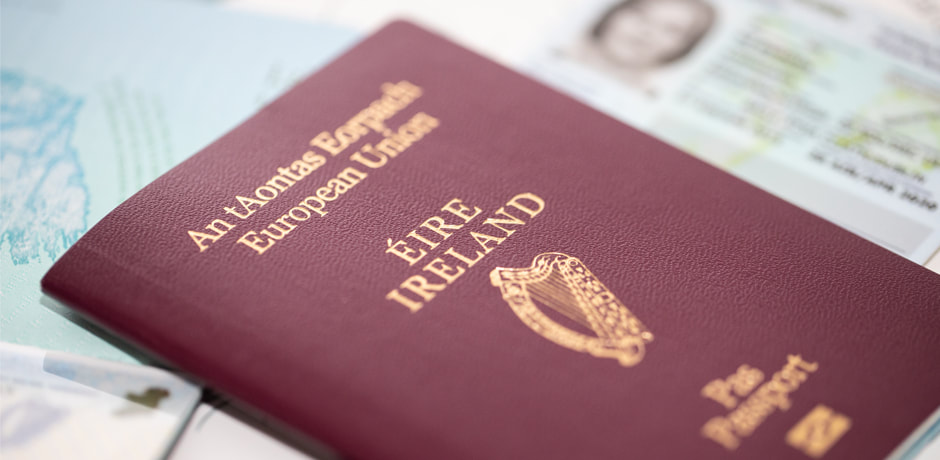 Irish passport and travel documents on table.