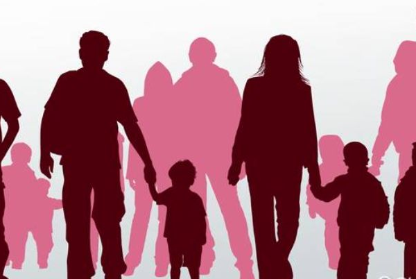 Silhouettes of diverse families walking together.