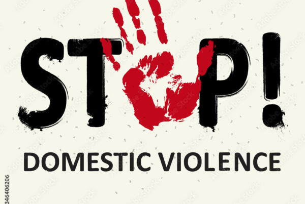 Stop domestic violence message with red handprint on a white background.