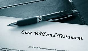 Pen on Last Will and Testament document on a desk.