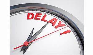 Clock face with the word Delay in bold red letters, indicating a postponement.