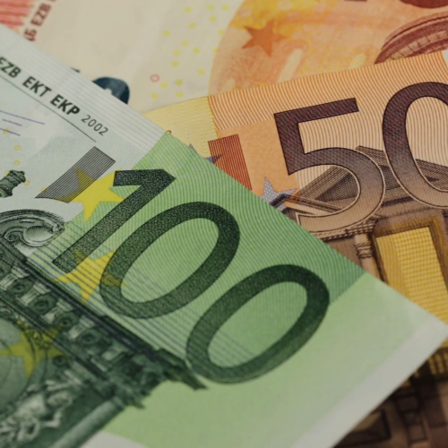 Euro banknotes in denominations of 100 and 50, close-up view.