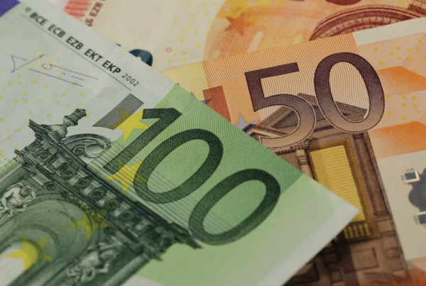 Euro banknotes in denominations of 100 and 50, close-up view.