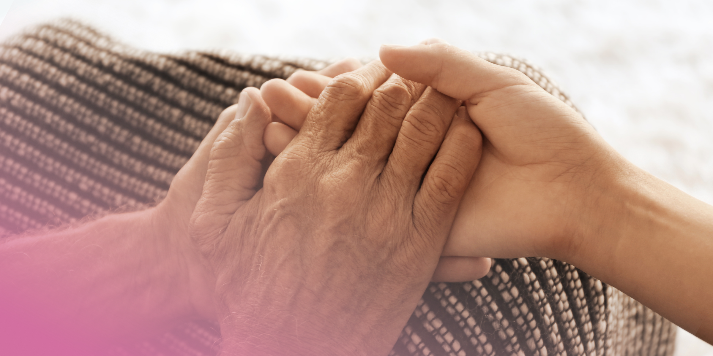 Holding an elderly lady's hands to symbol caring for their capacity