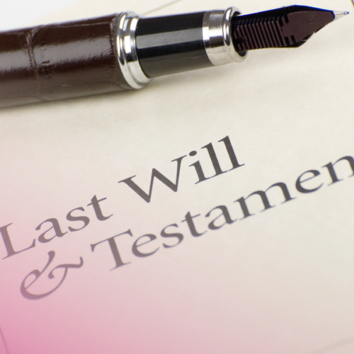 Fountain pen resting on a last will and testament legal document