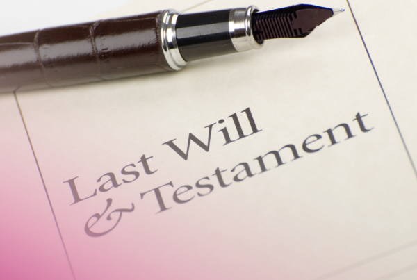 Fountain pen resting on a last will and testament legal document