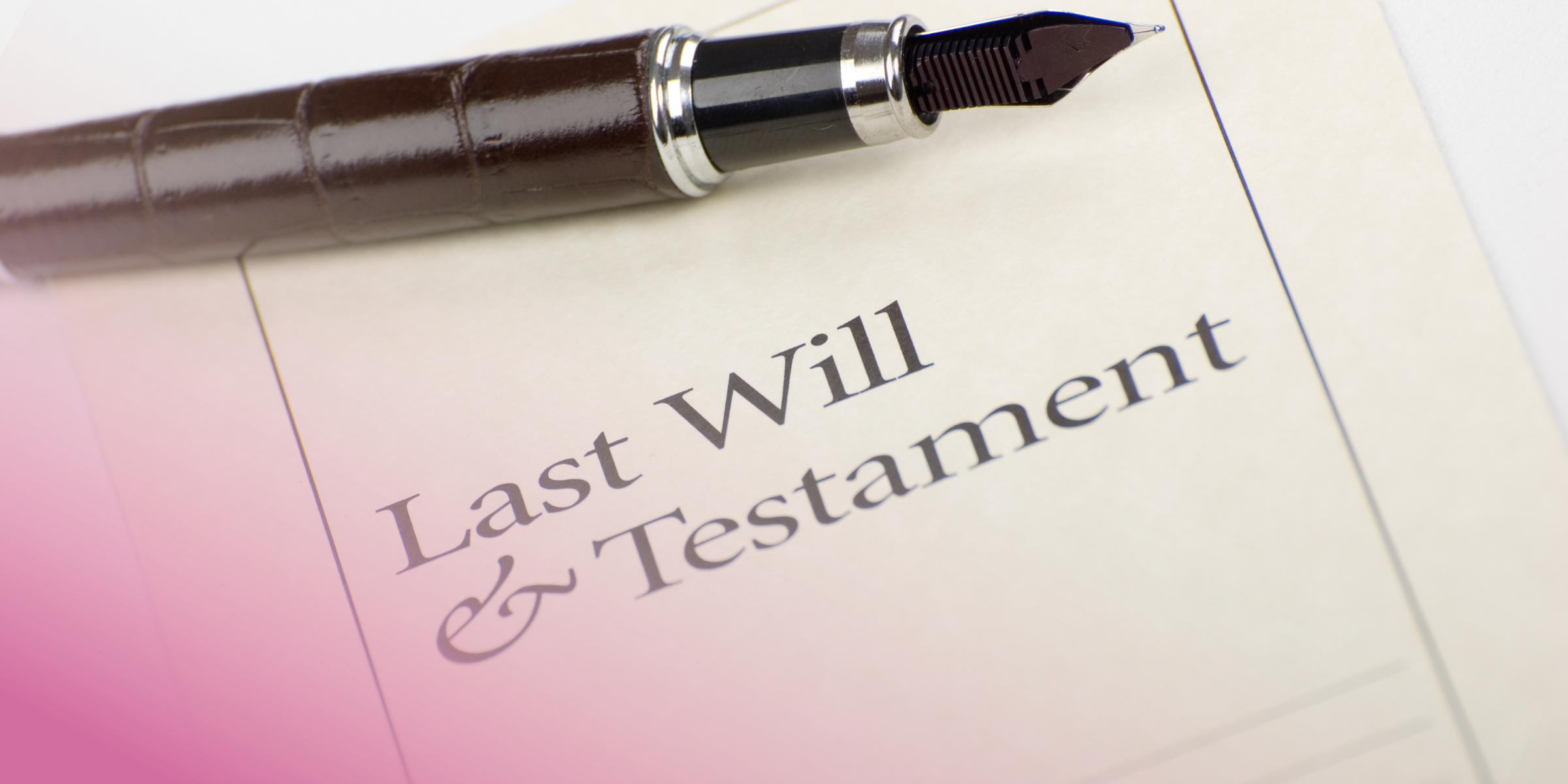 Fountain pen resting on a last will and testament legal document