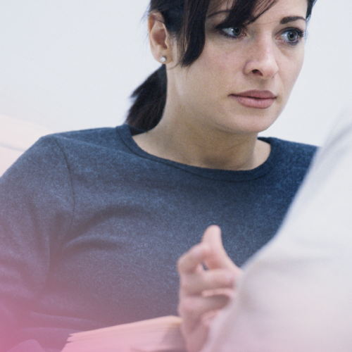 Woman attentively listening during a conversation.
