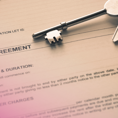 Tenancy agreement with keys on top, symbolising property rental or lease arrangement.