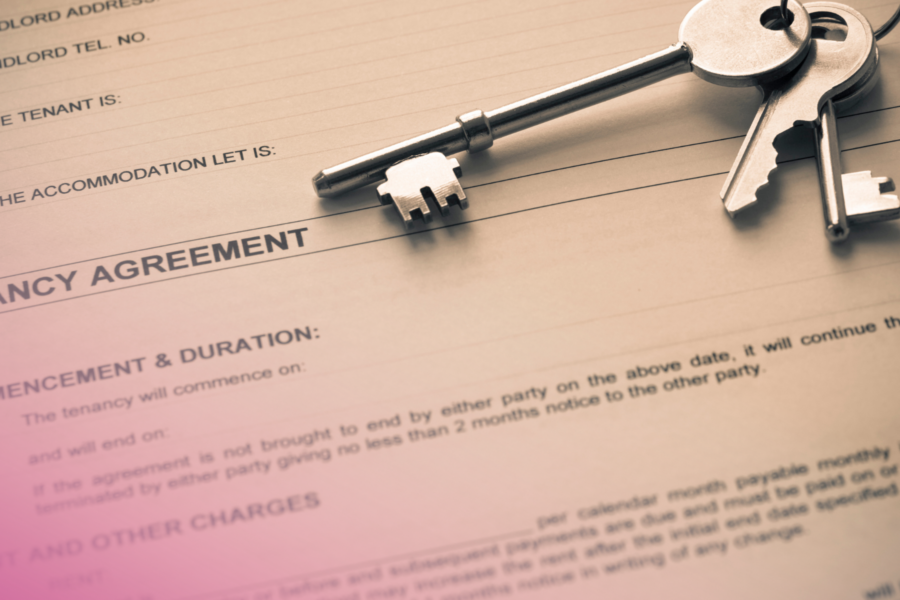 Tenancy agreement with keys on top, symbolising property rental or lease arrangement.