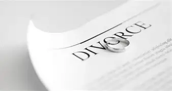 Divorce document with wedding ring symbolising marital separation.